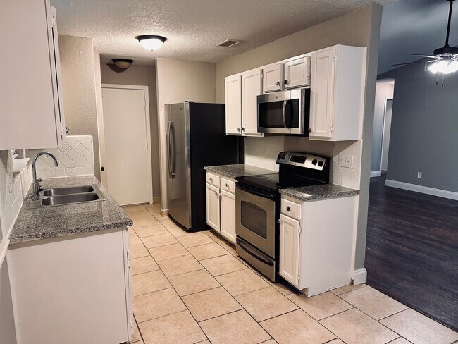 Kitchen with stainless steel appliances - 1502 Legget St