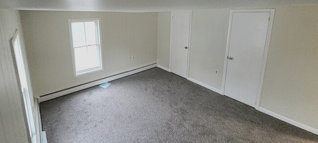 Bright and cozy living room perfect for relaxation and entertaining. - 7 White St