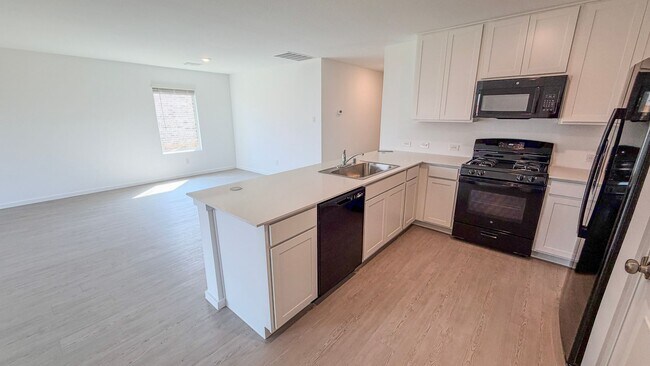 Building Photo - Just Built | Spacious Layout | Private Backyard Retreat