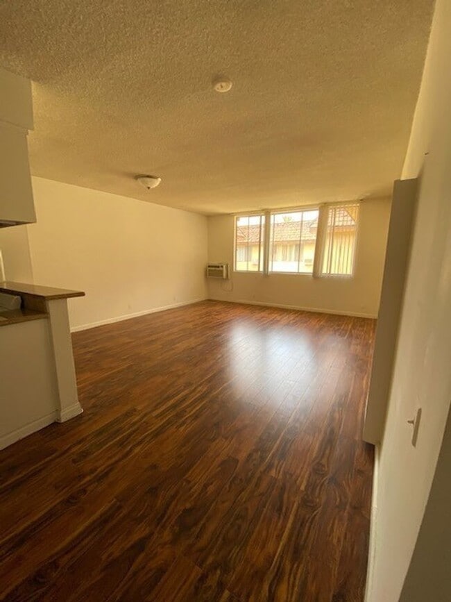 Interior Photo - Remodeled apartments *Hardwood Floors* *Intercom* *Garage parking*