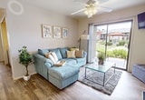 Located at 2601 E McKellips Rd in Mesa, AZ, this 830-square-foot, single-story apartment offers a practical and comfortable layout with 2 bedrooms, 1 bathroom, a living room, kitchen, hallway, and 2 closets. Wood-look flooring runs throughout the unit, providing a cohesive and clean aesthetic.

The living room is a welcoming space featuring a tile-surround fireplace, a ceiling fan, and a sliding glass door that opens to a patio with views of the surrounding landscaped grounds, allowing abundant natural light to fill the room.

The galley-style kitchen is efficiently designed with warm wood cabinetry, dark granite-style countertops, and white appliances including a refrigerator, electric range, and dishwasher, making the most of the available space.

The primary bedroom spans 150 square feet and includes a ceiling fan, a window with natural light, and ample room for a full dresser setup. The second bedroom also features a ceiling fan and a window with outdoor views, offering a bright and airy feel. Both rooms are served by two dedicated closets.

The bathroom includes a dark granite-style vanity countertop, wood cabinetry, and a tub-shower combination, completing this well-appointed Mesa apartment.