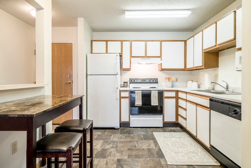 Highland View ofrece una vida cómoda con interiores espaciosos y todos los elementos esenciales para una casa que se adapte a su estilo de vida. - Highland View Apartments