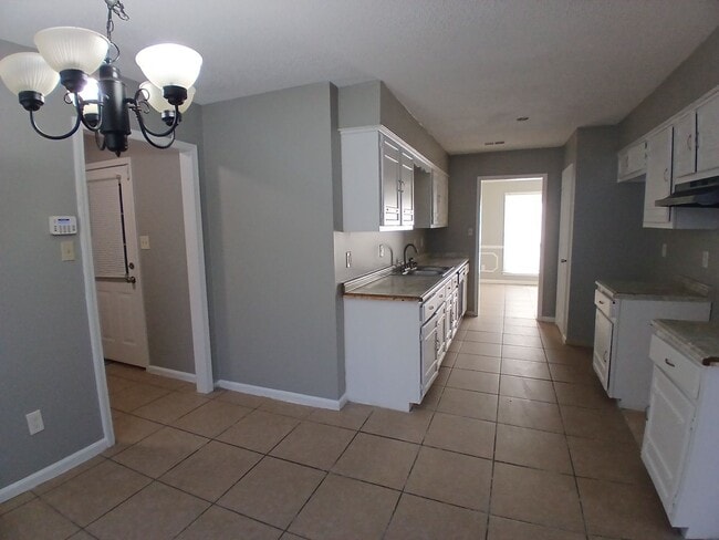 Photo - Blend of scale and sophistication in this expansive 3-bedroom, 2 bath residence - Open To Section 8 House