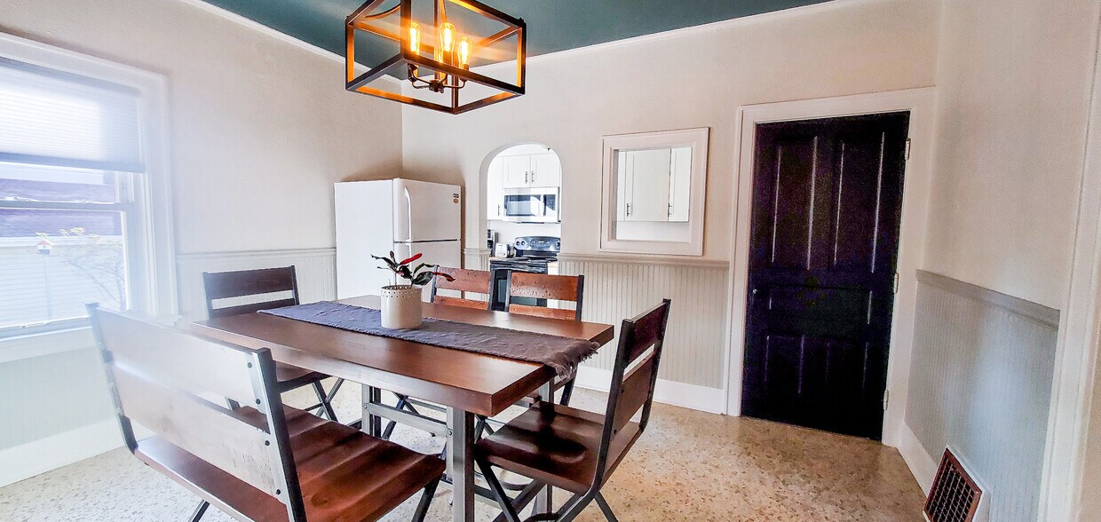 Dining Room Looking into Kitchen + door to attached Basement/Garage - 1912 N 2nd St