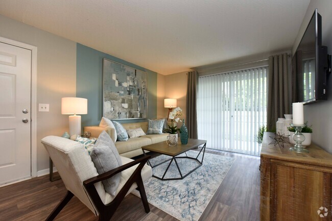 Living Room with Hardwood Style Flooring - Brookhaven Apartments