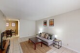 Located at 4200 W 34th Street in Houston, TX, this single-floor, one-bedroom, one-bathroom unit offers a well-organized and functional layout across a compact but efficient footprint. Light-toned tile flooring runs throughout the unit, lending a clean and cohesive look to every room.

The living room provides a comfortable gathering space, featuring neutral walls, a large window that brings in natural light, and enough room for a full sofa and coffee table arrangement. It opens seamlessly into a dedicated dining area, creating a natural flow for everyday living and entertaining.

The kitchen is designed for efficiency, featuring white cabinetry, granite-look countertops, and full appliances including a range, refrigerator, and built-in microwave. An adjacent pantry offers valuable additional storage. A hallway connects the main living areas to the private quarters.

The spacious primary bedroom accommodates a full-size bed with room to spare, and includes a ceiling fan with light fixture and a window for natural ventilation. A dedicated closet provides organized storage, with direct access to the full bathroom. The bathroom is clean and bright, featuring a tiled tub-shower combination with white finishes throughout.
