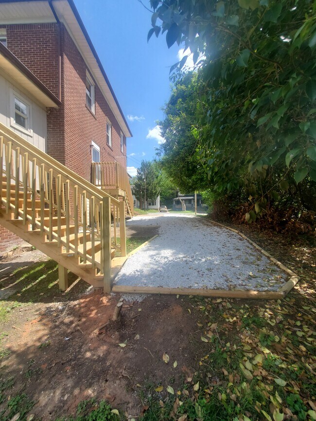 Large gravel driveway leading to newly built side deck and back deck - 2514 N Patterson Ave