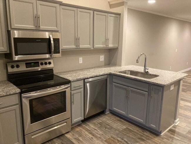 Building Photo - COMING SOON!!! End Unit townhome in Westwi...