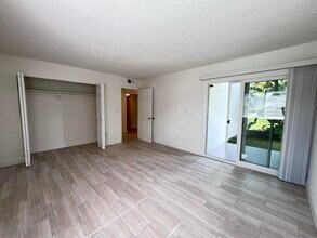 Master Bedroom + Patio - Sailpoint Bay Apartments