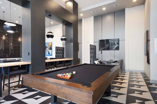 Unleash your competitive side with a game of pool in the lounge, perfect for fun and friendly matches. - Windsor Metro West