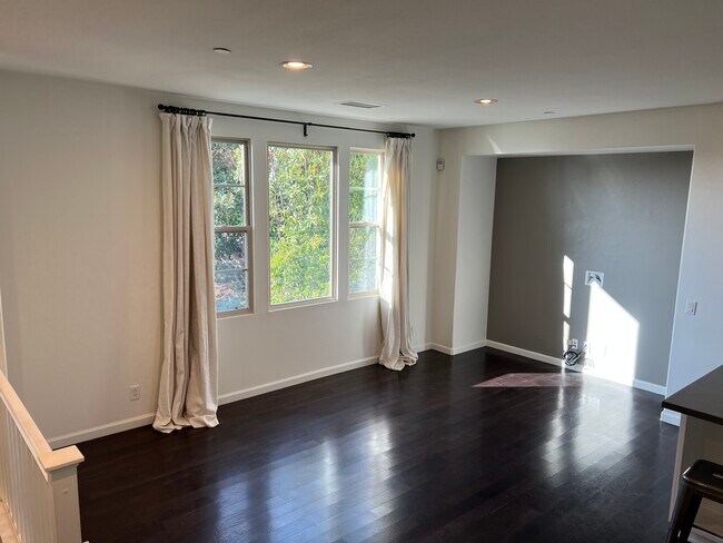 Spacious living room with mounted TV hook-up - 1747 Grand Ave