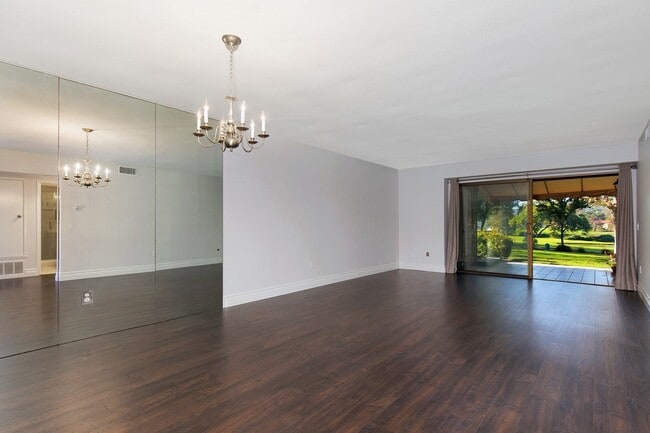 Building Photo - Lake and Golf Course View- Remodeled Condo w/ 2 Car Garage!