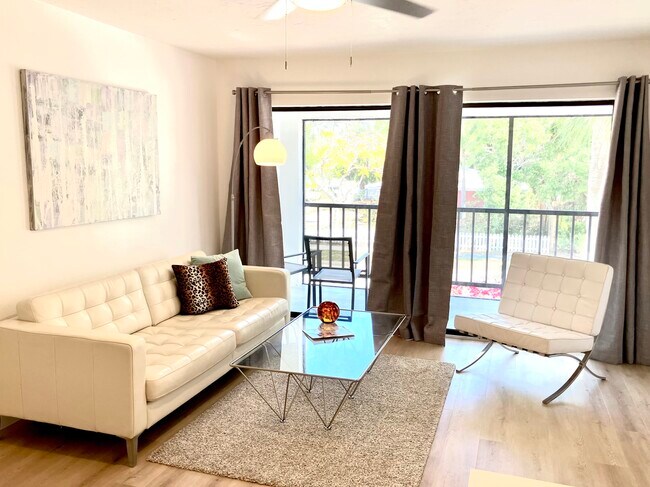 screened porch with large storage closet off living room - 631 N Orange Ave