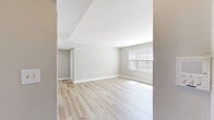 Located at 8402 Greenway Road in Towson, Maryland, this single-floor, four-bedroom residence offers a clean, functional layout well-suited for comfortable living. Throughout the home, light hardwood flooring and neutral gray-toned walls create a bright, cohesive aesthetic that ties each room together seamlessly.

The spacious primary bedroom is notably generous in size, featuring two closets with white paneled doors and direct access to adjoining spaces, providing both privacy and practicality. The additional three bedrooms are well-proportioned, each finished with the same light hardwood flooring and neutral walls. Several bedrooms benefit from large, white-framed double-hung windows that invite abundant natural light and offer views of the surrounding neighborhood.

The kitchen is equipped with warm oak cabinetry, a gas range, a single-basin sink, and countertop workspace, with a large window above providing natural light and outdoor views. The layout is straightforward and efficient, connecting to the rest of the home via a central hallway that facilitates easy navigation between rooms.

The overall ambiance of this residence is clean, bright, and move-in ready, with consistent finishes throughout that provide a neutral canvas adaptable to a variety of interior styles.