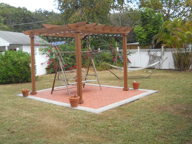 Detached Pergola with electric and brick pad. - 729 Braidwood Ln