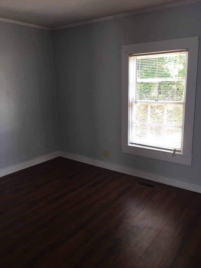 Building Photo - Your Own Home and Yard Centrally Located 3...