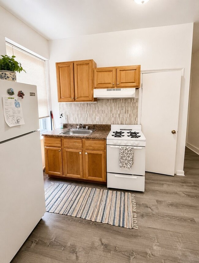 Photo - 7020 Woodland Ave Apartment