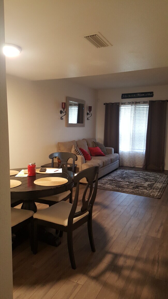 Dining and left side of living room (furnishings/decor not included) - 7801 N 44th Dr