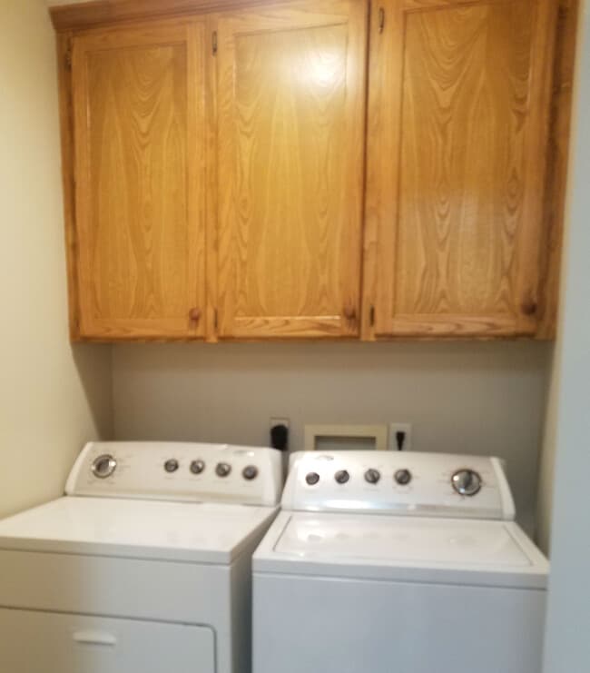 Enclosed Laundry Room with Storage above - 5121 Galloping Way