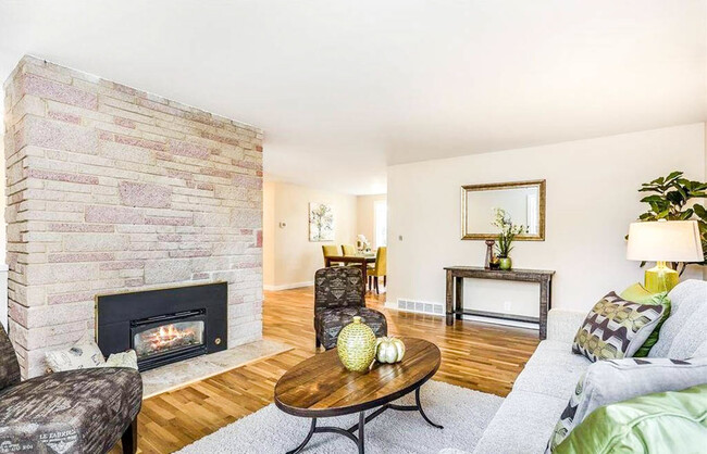 Cozy living area highlighted with a fireplace! - 323 NE 193rd St