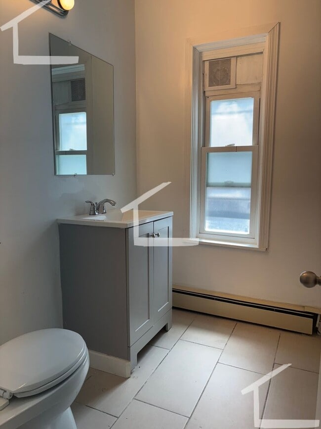 Photo - Huge 4 bed 2 bath unit with in-unit laundry! House