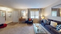 Located at 300 Pelham Rd in Greenville, South Carolina, this two-floor residence offers a thoughtfully designed layout with a variety of comfortable living spaces. The kitchen is outfitted with white shaker-style cabinetry, granite countertops, stainless steel appliances, and wood-style flooring, creating a clean and functional workspace. Adjacent to the kitchen, a dedicated dining area features wood-style floors, a bright window with blinds, and chair rail detailing along the walls.

The living room provides a relaxed atmosphere with plush carpet, natural light from large windows dressed with patterned curtains, and ample space for seating and entertainment. Multiple bedrooms are spread across the two floors, each featuring soft carpeting, generous windows that invite natural light, and well-proportioned layouts suited for restful retreats.

The bathrooms are finished with white vanity cabinetry, dark countertops, and wood-style flooring. One bathroom includes a sleek sliding-door enclosed shower, while another offers a tub-shower combination. Throughout the residence, neutral wall tones create a cohesive and versatile backdrop, while consistent trim and millwork details add a polished finish to every room.