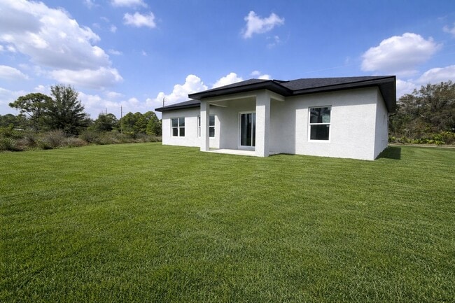 Building Photo - MODERN BRAND NEW RETREAT IN LEHIGH ACRES!