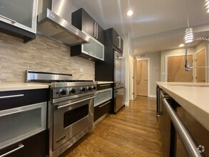 Luxurious kitchen with stainless steel appliances - 3525 N Reta Ave