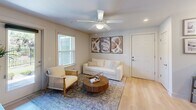 Located at 9641 Farrow Rd in Columbia, SC, this 2-bedroom, 3-bathroom residence offers a thoughtfully designed single-floor layout that maximizes comfort and functionality. Light wood-look flooring flows throughout the main living areas, creating a cohesive and contemporary feel.

The living room is bright and inviting, featuring a ceiling fan, recessed lighting, and multiple windows that allow generous natural light and views of the surrounding greenery. A private exterior door provides direct outdoor access, adding convenience and connectivity to the outdoors.

The galley-style kitchen is efficiently designed with dark espresso cabinetry, granite-look countertops, a stainless steel appliance suite including a range, microwave, and refrigerator, and a double basin sink — offering ample workspace for everyday cooking.

The primary bedroom is generously sized, with large windows, plush carpet, a ceiling fan, and a walk-in closet. Its en-suite bathroom features dark-framed cabinetry, granite countertops, and a well-lit vanity mirror. The second bedroom is equally comfortable with its own closet space and a dedicated bathroom nearby.

Three full bathrooms throughout the unit ensure convenience for residents and guests alike. A dedicated hallway and closet provide additional storage. The overall ambiance is clean, modern, and move-in ready.