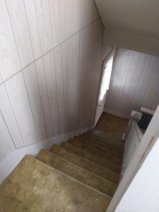 View from landing down to Door to covered porch - 62 Bridge St