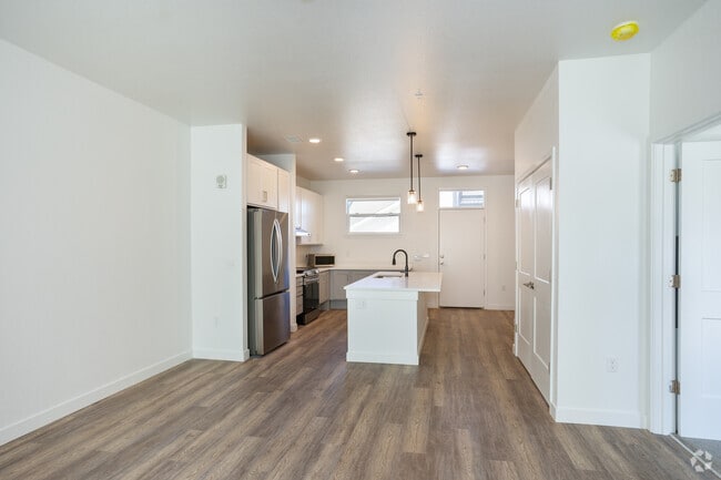 3BR, 2BA - 1,230SF - Living Room / Kitchen - Pine Ridge Crossings