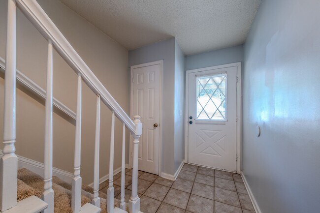Building Photo - Freshly Updated 2 Bedroom Townhome with Fenced Outdoor Space – Convenient Greensboro Location