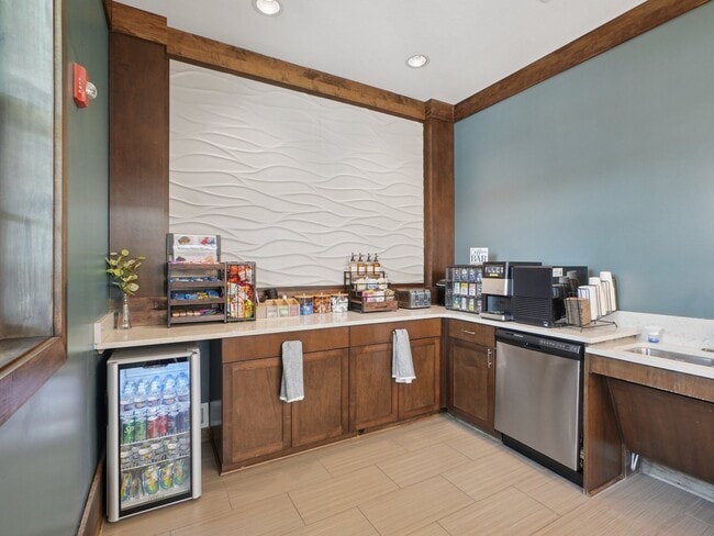 Modern resident coffee bar and refreshment area at Village at Broadstone Station in Apex, North Carolina - Village at Broadstone Station