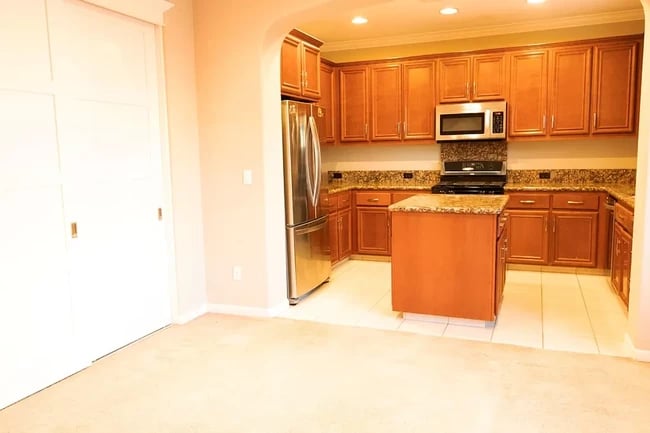 Kitchen with pantry door on the side - 7754 Stoneleaf Rd