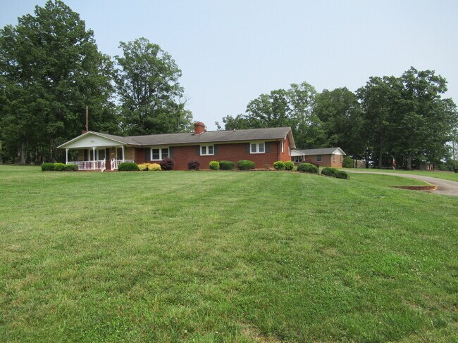 Building Photo - Charming All-Brick Ranch with Finished Bas...