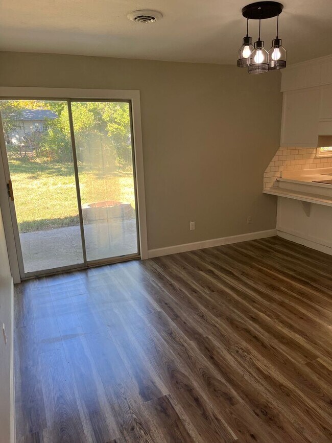 Building Photo - Flexible 4-Bedroom Home with Fenced Backyard