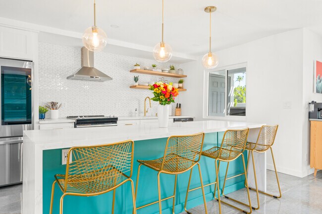 Have a few drinks at the kitchen island while watching the designated chef in action. - 2104 N Volturno Rd