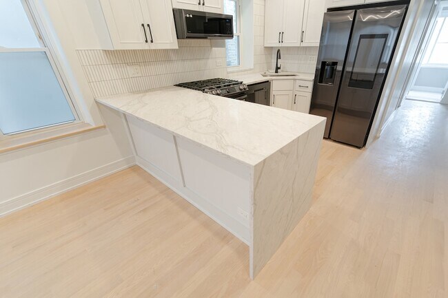 Foto del edificio - 4148 W Wellington Ave