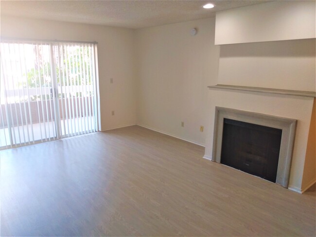 Living Room w Hardwood Floor - Palms Crest Apartments