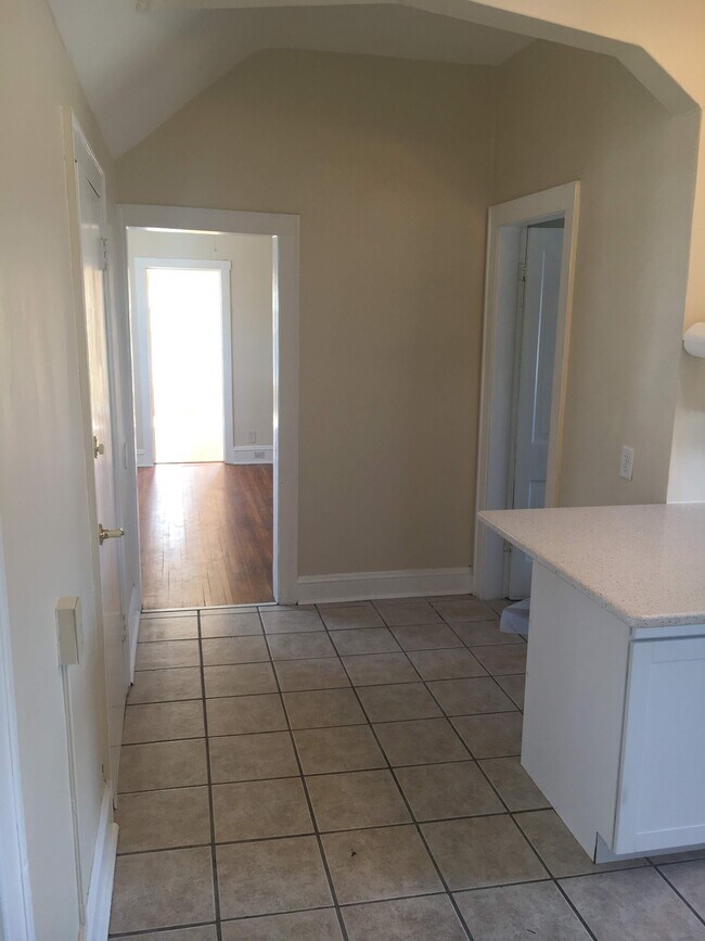 From kitchen looking towards living room with master bedroom beyond - 279 Forbes Ave