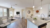 This contemporary 1090 square foot apartment offers a thoughtfully designed living space across a single floor. The open-concept layout seamlessly integrates the living, dining, and kitchen areas, creating an inviting atmosphere for both relaxation and entertainment. The kitchen boasts white cabinetry, stainless steel appliances, and granite countertops, perfect for culinary enthusiasts.

The two bedrooms provide ample space, with the primary bedroom measuring a generous 160 square feet. Both bathrooms feature modern fixtures and finishes, including a granite-topped vanity in one. The apartment includes a dedicated office space, ideal for remote work or study.

Storage is abundant, with a walk-in closet and additional closet spaces throughout. The in-unit laundry room adds convenience to daily life. Throughout the apartment, neutral tones and wood-look flooring create a cohesive, contemporary aesthetic.

Large windows in the living area and bedrooms allow natural light to flood the space, while offering picturesque views of the surroundings. The apartment's thoughtful design maximizes functionality without compromising on style, making it an ideal home for modern living in Distrito Central, Francisco Morazán.