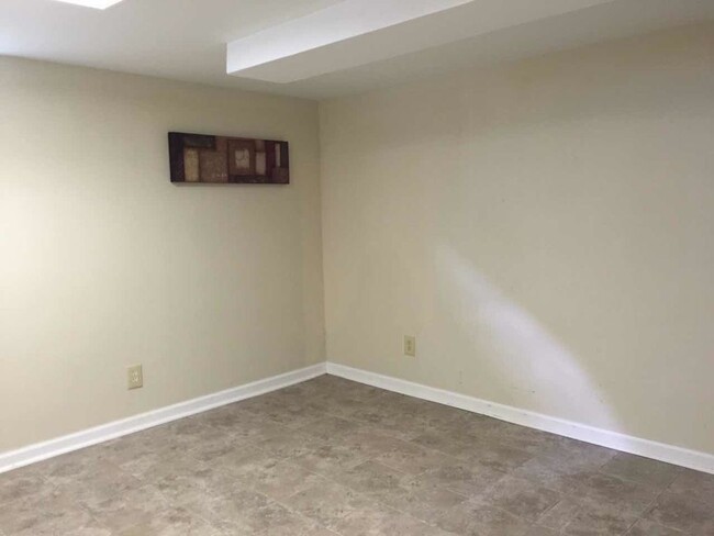 Finished room in basement. - 8726 Florence Avenue