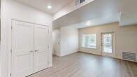 Located at 771 Harrington Way in Folsom, CA, this single-floor unit offers three bedrooms, two bathrooms, and a thoughtfully designed open layout. Light wood-look flooring runs throughout, creating a cohesive and clean aesthetic that complements the crisp white walls and modern finishes.

The kitchen and living area share an open, connected space ideal for everyday living. The kitchen features warm wood-tone cabinetry, white countertops, a built-in dishwasher, a refrigerator, and a stainless steel sink — all positioned to maximize functionality. A set of double doors off the kitchen provides additional storage access.

The living area is bright and open, with a glass-panel exterior door and adjacent window that invite natural light and outdoor views of the surrounding neighborhood. Each of the three bedrooms is well-proportioned, with large windows dressed in white blinds that offer garden and neighborhood views while maintaining privacy. The primary bedroom includes a dedicated closet.

Both bathrooms follow the same clean design language, featuring wood-tone vanities with white countertops, large mirrors, shower/tub combinations, and light wood-look flooring. The result is a modern, move-in-ready space with a cohesive design throughout.