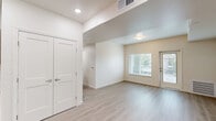 Located at 771 Harrington Way in Folsom, CA, this single-floor unit offers three bedrooms, two bathrooms, and a thoughtfully designed open layout. Light wood-look flooring runs throughout, creating a cohesive and clean aesthetic that complements the crisp white walls and modern finishes.

The kitchen and living area share an open, connected space ideal for everyday living. The kitchen features warm wood-tone cabinetry, white countertops, a built-in dishwasher, a refrigerator, and a stainless steel sink — all positioned to maximize functionality. A set of double doors off the kitchen provides additional storage access.

The living area is bright and open, with a glass-panel exterior door and adjacent window that invite natural light and outdoor views of the surrounding neighborhood. Each of the three bedrooms is well-proportioned, with large windows dressed in white blinds that offer garden and neighborhood views while maintaining privacy. The primary bedroom includes a dedicated closet.

Both bathrooms follow the same clean design language, featuring wood-tone vanities with white countertops, large mirrors, shower/tub combinations, and light wood-look flooring. The result is a modern, move-in-ready space with a cohesive design throughout.