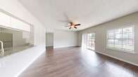 Located at 1508 Teal St in Fishers, Indiana, this well-appointed one-bedroom, one-bathroom unit offers a comfortable and functional single-floor layout. The open living area is bright and welcoming, featuring wood-style plank flooring, neutral toned walls, a textured ceiling, and a ceiling fan. Large sliding glass doors provide access to an outdoor balcony while inviting generous natural light, complemented by additional windows with blinds that frame pleasant exterior views.

The kitchen is efficiently designed with white cabinetry, granite countertops, black appliances including a range and microwave, a stainless steel refrigerator, and a peninsula with a stainless steel sink — ideal for both everyday cooking and entertaining.

The full bathroom continues the granite theme with a wide vanity, white cabinetry, a large wall mirror with overhead lighting, and a shower/tub combination. The generously sized bedroom features plush carpeting, a ceiling fan, a walk-in closet, and a natural light-filled window with exterior views. Additional closet storage and an in-unit laundry area add to the practicality of the layout. Throughout, the neutral color palette and clean finishes create a cohesive, move-in-ready atmosphere.