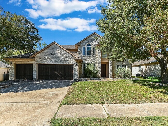 Front yard with 3 car garage. - 19910 Kennemer Dr