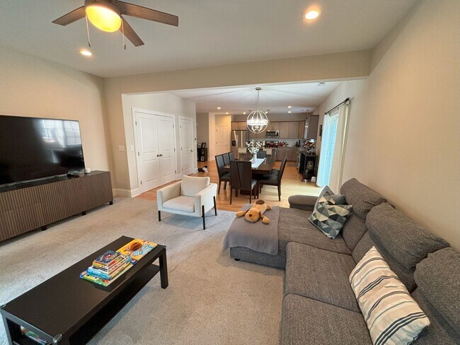 Main floor, living room and dining room open floor concept. Carpet and hardwood flooring. - 140 Wells View Rd