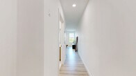 This thoughtfully designed one-bedroom, one-bathroom unit in Everett, MA offers a clean, modern aesthetic throughout its efficiently utilized single-floor layout. Light hardwood flooring runs seamlessly across the entire space, contributing to a bright and cohesive feel.

The open living area serves as the heart of the unit, featuring multiple large windows that flood the room with natural light and provide pleasant outdoor views. Recessed lighting and a wall-mounted mini-split system ensure year-round comfort. The space comfortably accommodates both a living and dining arrangement, making it highly functional.

The bedroom is a calm, well-proportioned retreat finished in neutral tones. It includes a wall-mounted mini-split unit for independent climate control and features two built-in closets, providing generous storage. Light walls and understated finishes give the room a clean, restful atmosphere.

The bathroom is finished to a high standard, showcasing large-format white tile, a frameless glass-enclosed walk-in shower with polished nickel hardware, and crisp white panel doors. The minimalist design keeps the space feeling fresh and spa-like.

Overall, this unit presents a modern, move-in-ready living environment with quality finishes, practical storage solutions, and a light-filled interior well-suited for comfortable everyday living in Everett, MA.