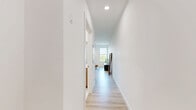 This thoughtfully designed one-bedroom, one-bathroom unit in Everett, MA offers a clean, modern aesthetic throughout its efficiently utilized single-floor layout. Light hardwood flooring runs seamlessly across the entire space, contributing to a bright and cohesive feel.

The open living area serves as the heart of the unit, featuring multiple large windows that flood the room with natural light and provide pleasant outdoor views. Recessed lighting and a wall-mounted mini-split system ensure year-round comfort. The space comfortably accommodates both a living and dining arrangement, making it highly functional.

The bedroom is a calm, well-proportioned retreat finished in neutral tones. It includes a wall-mounted mini-split unit for independent climate control and features two built-in closets, providing generous storage. Light walls and understated finishes give the room a clean, restful atmosphere.

The bathroom is finished to a high standard, showcasing large-format white tile, a frameless glass-enclosed walk-in shower with polished nickel hardware, and crisp white panel doors. The minimalist design keeps the space feeling fresh and spa-like.

Overall, this unit presents a modern, move-in-ready living environment with quality finishes, practical storage solutions, and a light-filled interior well-suited for comfortable everyday living in Everett, MA.
