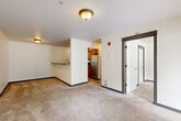 Located at 600 Lincoln St in Bellingham, WA, this single-floor unit offers a functional and well-organized layout across three bedrooms and two full bathrooms. The open-concept living and dining area is finished with plush wall-to-wall carpeting and flows seamlessly into the kitchen, which features warm wood cabinetry, a stainless steel refrigerator, and a convenient breakfast bar with a sink. The space is bright and clean, with neutral walls and flush-mount lighting throughout. Each of the three bedrooms is carpeted and features a window fitted with blinds that allows natural light to filter in. The primary bedroom is a comfortable size, accompanied by its own closet. With six closets total throughout the unit, storage is plentiful. The two bathrooms are finished with tile flooring in a warm earth tone. The full bathroom includes a single-sink vanity with wood cabinetry, a tub-shower combo, and a toilet, while the second bathroom offers a more compact configuration. Additional highlights include an in-unit laundry area, a hallway connecting the bedrooms, a welcoming entrance, and a private patio for outdoor enjoyment. The overall ambiance is clean, neutral, and move-in ready.